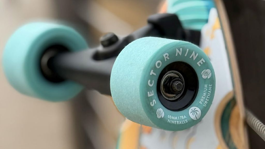 Skater comparing soft and hard skateboard wheels before installation