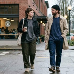 Minimalist Seattle street style featuring relaxed oversized tee layering in rainy weather