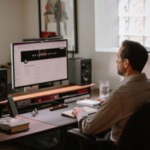 Modern minimalist home office featuring a simple desk and ergonomic chair